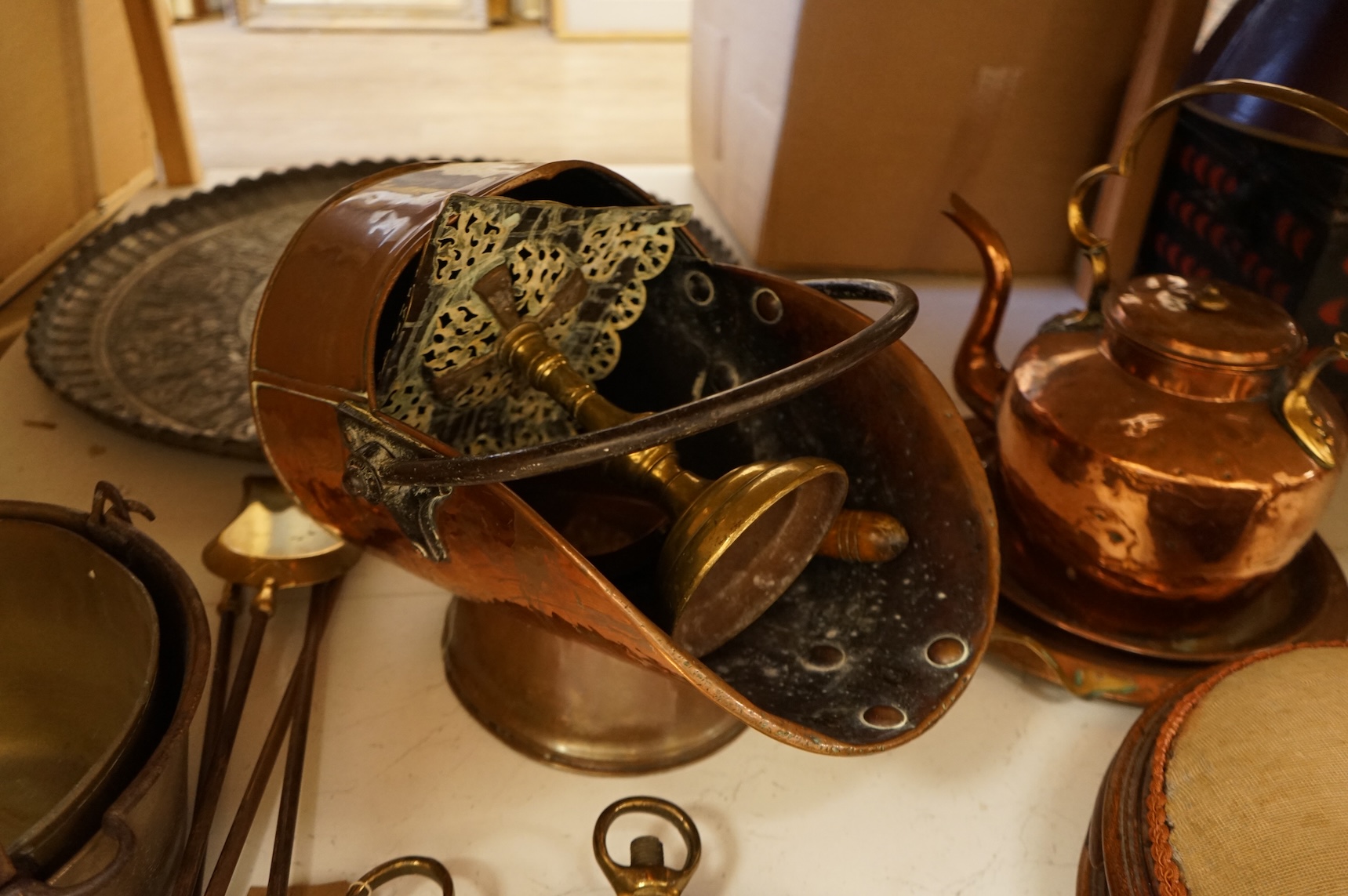 Assorted Victorian and later copper and brassware including two ships portholes, copper kettle pots, etc (16). Large porthole 36cm diameter